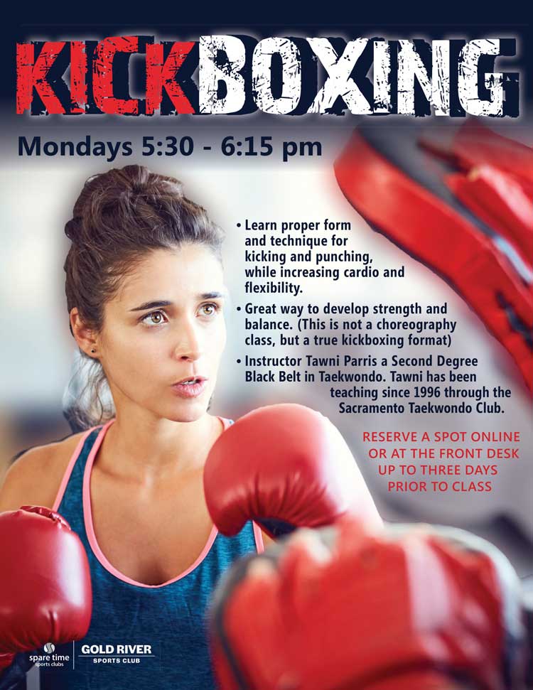 Female Boxer punching on pad